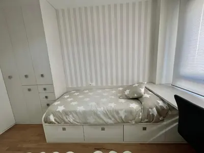 Cama o camas de una habitación en Apartamentos Ciudad del Calzado