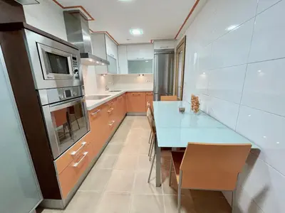 Una cocina o zona de cocina en Apartamentos Ciudad del Calzado