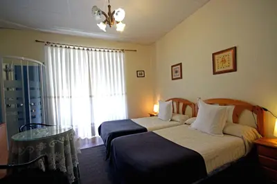 Cama o camas de una habitación en Pensión Leyre
