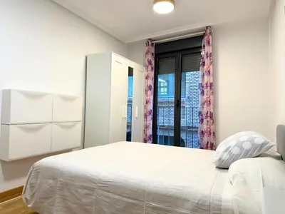 Cama o camas de una habitación en Dos Torres César Augusto - Larga temporada