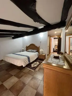 Cama o camas de una habitación en Apartamento dúplex en Sangüesa de 3 dormitorios y 2 baños