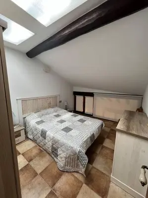 Cama o camas de una habitación en Apartamento dúplex en Sangüesa de 3 dormitorios y 2 baños