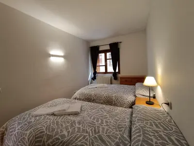 Cama o camas de una habitación en Inmocyma Tu Refugio en Benasque