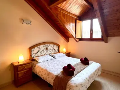 Cama o camas de una habitación en Dúplex el Torrent - L'Amfitriona
