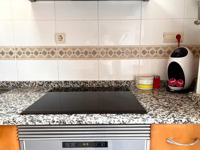 Una cocina o zona de cocina en Dúplex el Torrent - L'Amfitriona