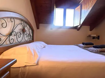 Cama o camas de una habitación en Dúplex el Torrent - L'Amfitriona