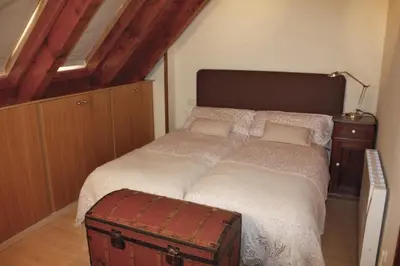 Cama o camas de una habitación en Apartamentos Valle de Aran