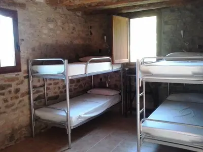 Cama o camas de una habitación en Albergue Casa Fumenal