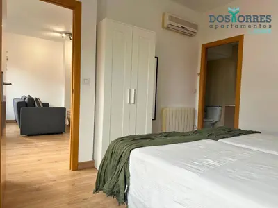 Cama o camas de una habitación en Dos Torres Pilar Suites- balcones con vistas a la ciudad