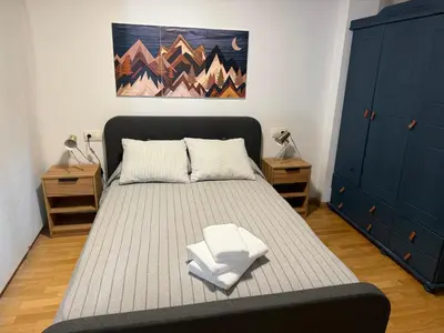 Cama o camas de una habitación en Apartamento céntrico con garaje