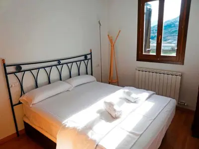 Cama o camas de una habitación en Apartamentos Sallent de Gállego 3000