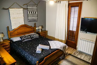 Cama o camas de una habitación en L'Amagatall de Talarn - Una casa familiar