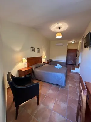 Cama o camas de una habitación en Hostal Centre Del Montsec