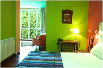 Cama o camas de una habitación en Hotel Ibaiondo