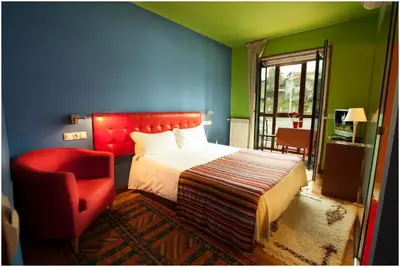 Cama o camas de una habitación en Hotel Ibaiondo