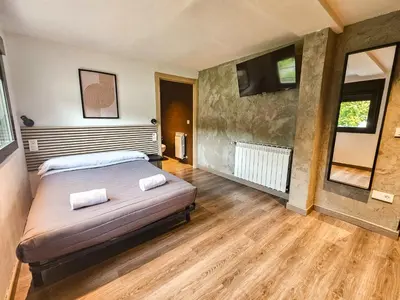 Cama o camas de una habitación en SOLOPUENT Hotel Rural