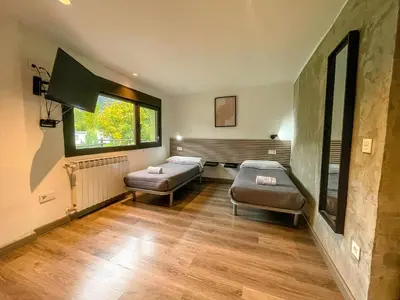 Cama o camas de una habitación en SOLOPUENT Hotel Rural