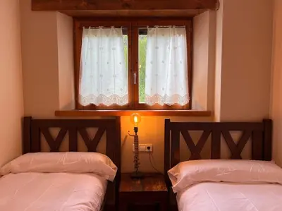 Cama o camas de una habitación en Cal Mestre - L'Amfitriona