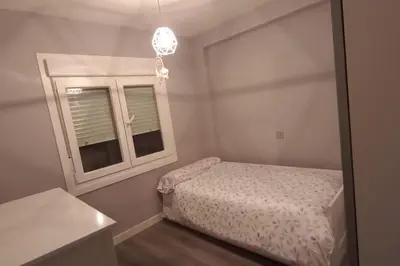 Cama o camas de una habitación en Apartamento cerca del Pilar