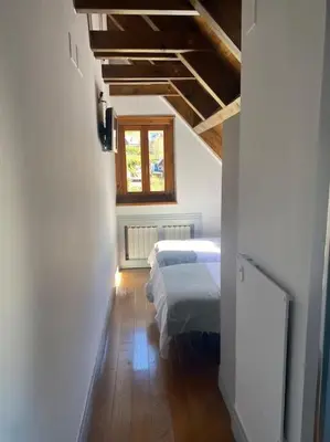 Cama o camas de una habitación en DUPLEX con encanto en Bagergue y guarda esquíes