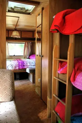 Cama o camas de una habitación en Camping Pirineos Cien Lagos