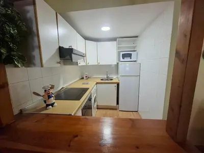 Una cocina o zona de cocina en La Encina, Acogedor apartamento con piscina - Arafita Apartamentos
