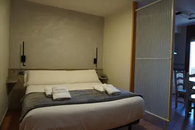 Cama o camas de una habitación en Apartamentos Casa DOMENC