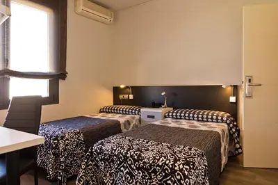 Cama o camas de una habitación en Hostal Plaza