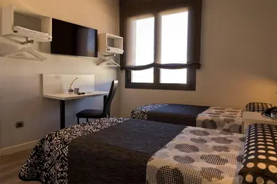 Cama o camas de una habitación en Hostal Plaza