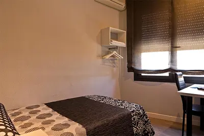 Cama o camas de una habitación en Hostal Plaza