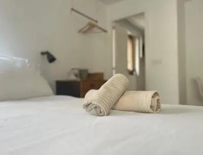 Cama o camas de una habitación en Apartamentos Nomad Home