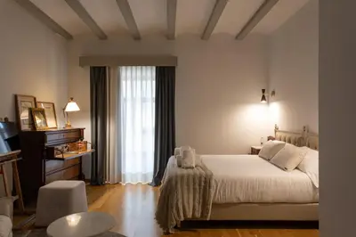 Cama o camas de una habitación en Hotel Palacio Barón de Andilla