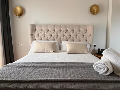 Cama o camas de una habitación en Hotel Palacio Barón de Andilla
