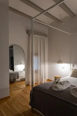 Cama o camas de una habitación en Hotel Palacio Barón de Andilla