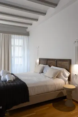 Cama o camas de una habitación en Hotel Palacio Barón de Andilla