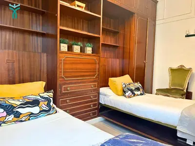 Cama o camas de una habitación en Dos Torres Lacarra- Confort y Estilo en el Centro de Zaragoza