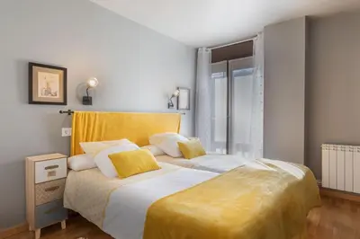 Cama o camas de una habitación en A1 eraclau - Eth Pedralles con 2 garages en VIELHA