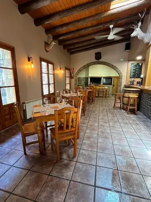 Un restaurante o sitio para comer en Posada OsTablaus