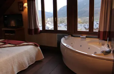Cama o camas de una habitación en Hotel Pradas Ordesa