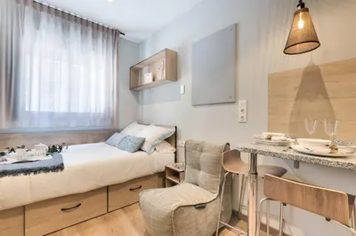 Cama o camas de una habitación en Livensa Living Pamplona Albergue Juvenil