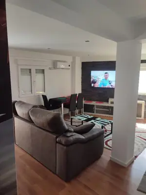 Una televisión o centro de entretenimiento en Apartamento cerca Plaza Pilar