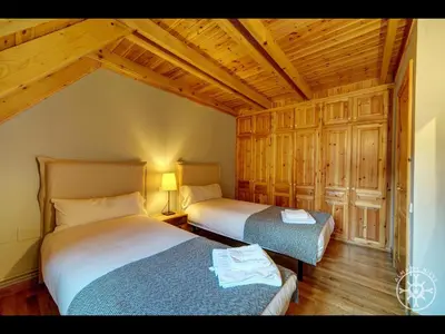 Cama o camas de una habitación en CASA BARLONGUETA de Alma de Nieve