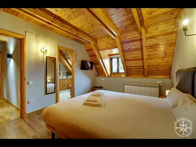 Cama o camas de una habitación en CASA BARLONGUETA de Alma de Nieve