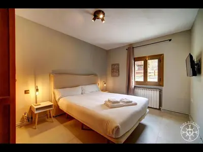 Cama o camas de una habitación en CASA BARLONGUETA de Alma de Nieve