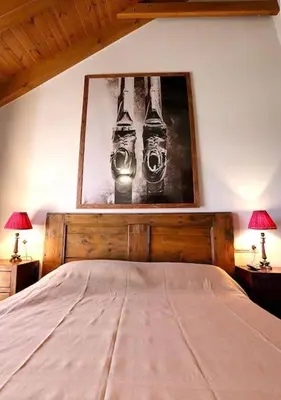 Cama o camas de una habitación en Precioso ático Esterri Aneu