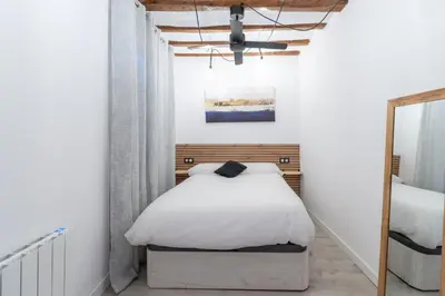 Cama o camas de una habitación en Encantador apartamento en el corazón de Pamplona