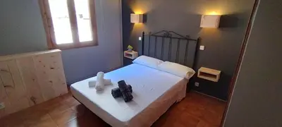 Cama o camas de una habitación en Casa Pirineus - Alojamiento rural & Alquiler de esquís - SKI Pirineus
