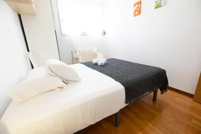 Cama o camas de una habitación en Ofrenda del Pilar Turistea