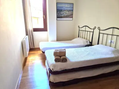 Cama o camas de una habitación en Apartament familiar amb vistes by RURAL D'ÀNEU