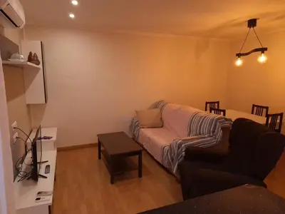 Una televisión o centro de entretenimiento en Apartamento El Cortijo